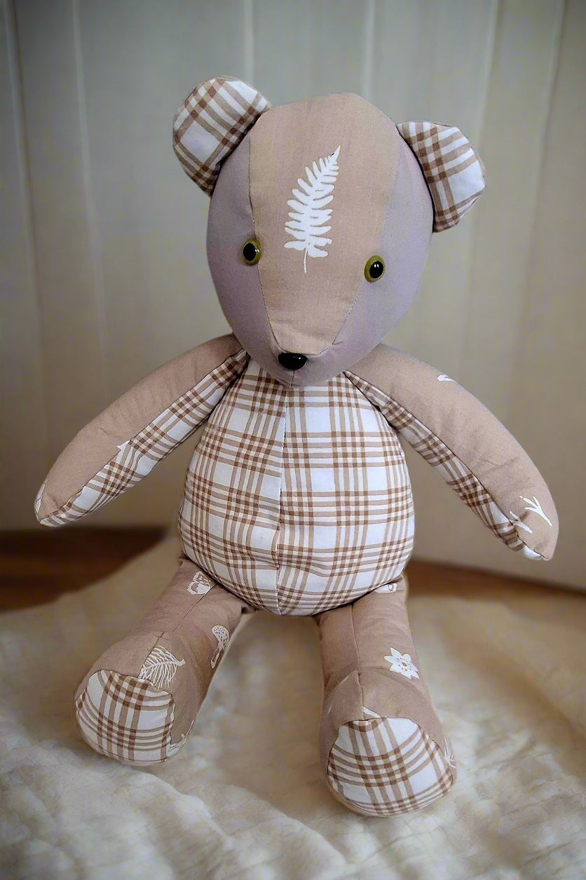Custom handmade memory bear created from customer's clothing, sitting pose, soft fabric and sentimental design, made in the UK by Baby Bundles Ltd.