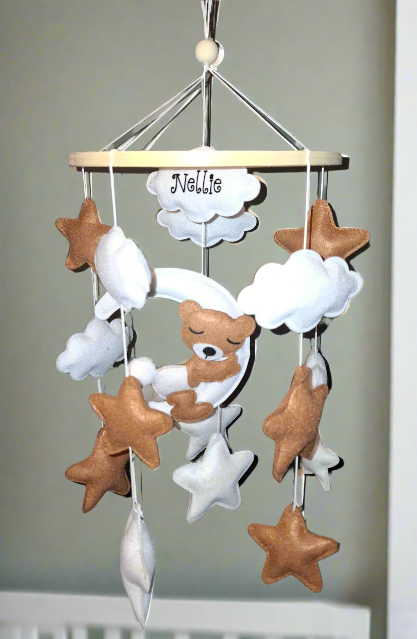 Baby mobile hanging above cot – dreamy neutral nursery inspiration